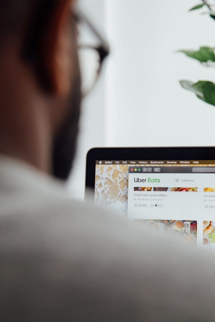 Person browsing food delivery options online.