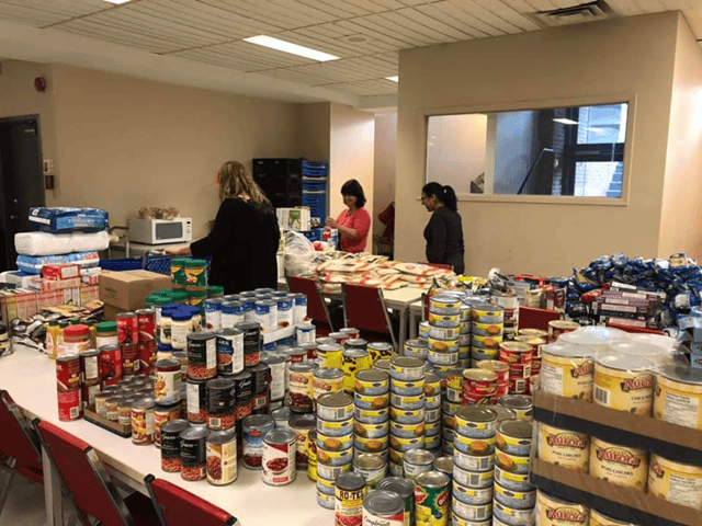 Volunteers organize food resources.